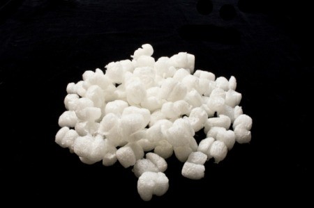 white packing peanuts on black background