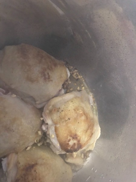 adding garlic to pan