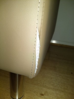 Repairing a Cut in Faux Leather Couch Upholstery - cut near side seam