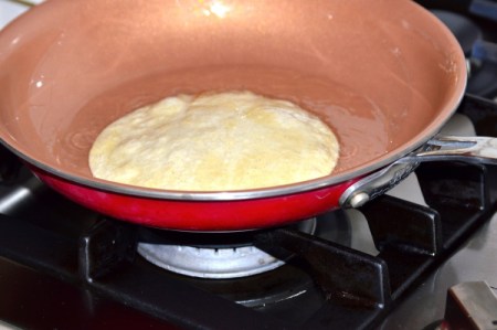 flipped tortilla in pan