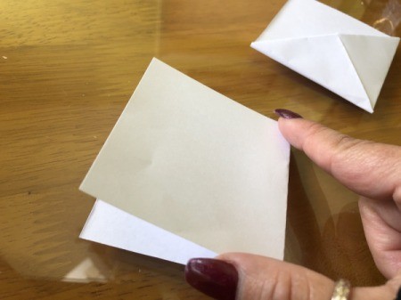 Folded Paper Bunny Corner Bookmark - fold one of the pieces of scrap paper in half