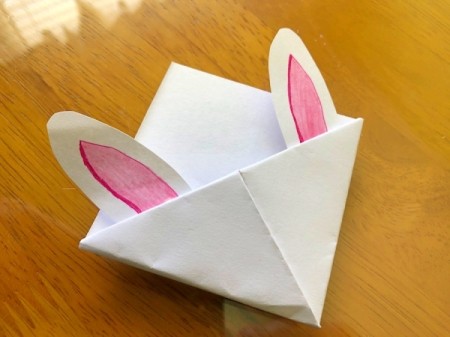 Folded Paper Bunny Corner Bookmark - add a bit of glue to the base of the ears and glue to the inside of the flap behind the fold
