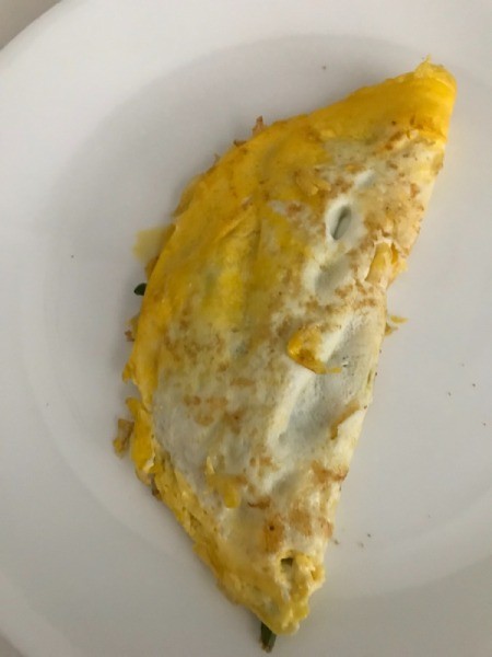 An omelet on a white plate.