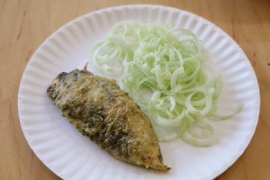 Pesto Parmesan Chicken Breast on plate with cucumbers