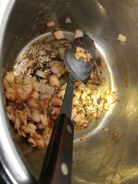 cooking garlic  and onions in pan