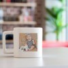 Square shaped mug with a picture of a baby on it.