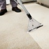 Carpet shampooer cleaning white carpet