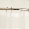 White shower curtain with stainless steel curtain rings.