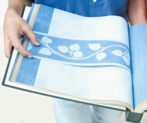 Wallpaper book with blue wallpaper.