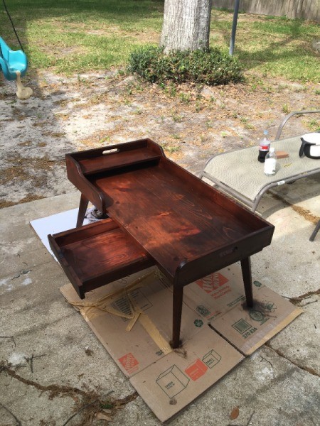 Information on Mid Century Antique Coffee Table - table sitting outside, drawer open