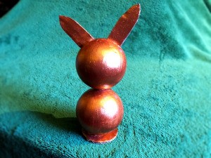 Styrofoam Ball Bunny Statue - finished bronze metallic bunny on turquoise background