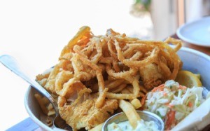 Fried onion strings on a plate.