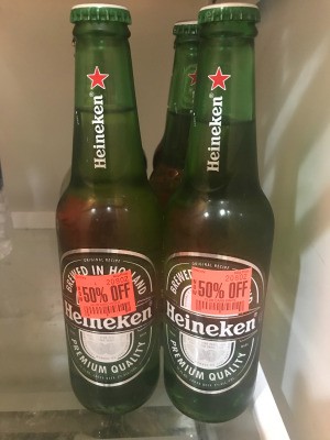 Heineken beer bottles that have been marked down.