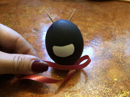 Standing Ninja Eggs - wrap a piece of ribbon around the egg under the unmasked face