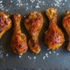 Roasted chicken legs on a cutting board