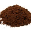 Pile of coffee grounds on a white background