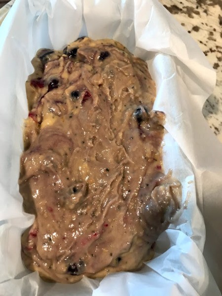 Lemon Berry Cake batter in lined pan