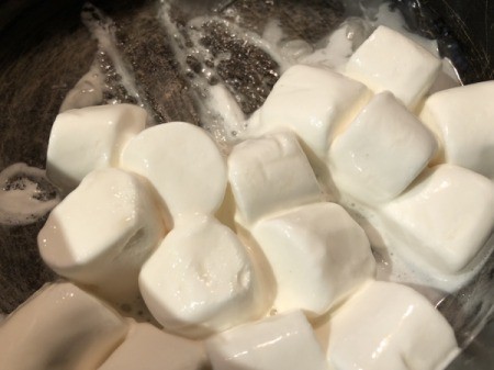 marshmallows and water heating in pan