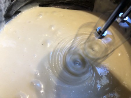mixing batter with electric mixer