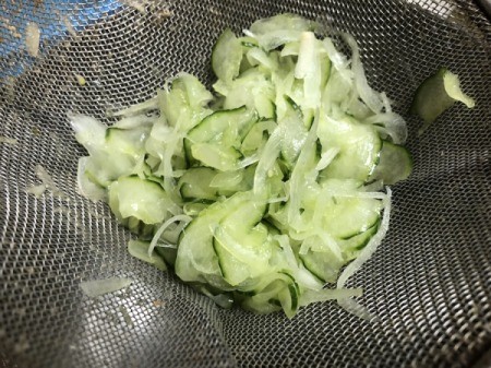rinsing and squeezing cucumber and onion to remove excess moisture
