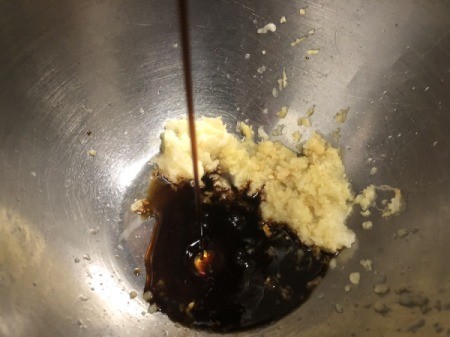 mixing soy sauce and ginger