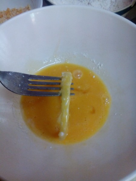 dipping onion in egg