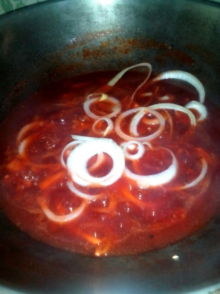Onion Rings added to sauce