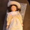 Porcelain Doll Identification - small porcelain doll wearing a straw hat