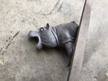 Making Plastic Animal Bookends - file the cut edges and check against a piece of the wood