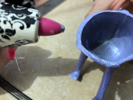 Making Plastic Animal Bookends - add glue to the cut edge of the animal