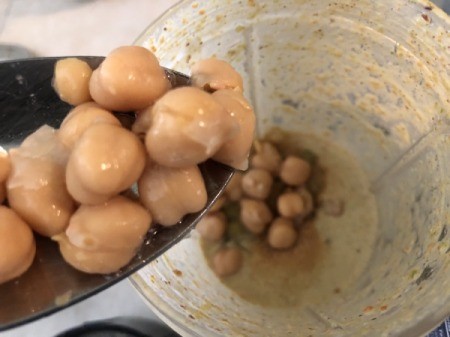 adding garbanzo beans to blender