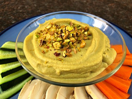 Pistachio Hummus on plate with cut vegetables