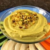 Pistachio Hummus on plate with cut vegetables
