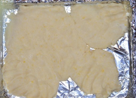 spreading dough on baking sheet