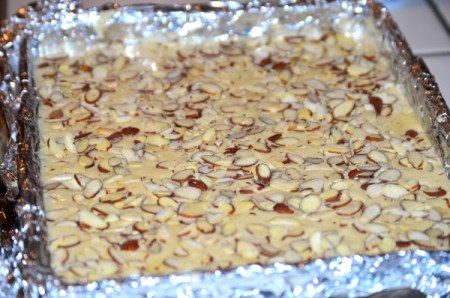 Almond and egg whites spread on baking sheet