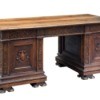 Carved antique wooden desk on a white background