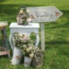 Vintage themed wedding and reception decorations on grass