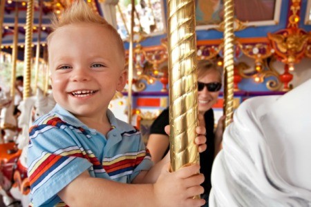 Little boy on carousel