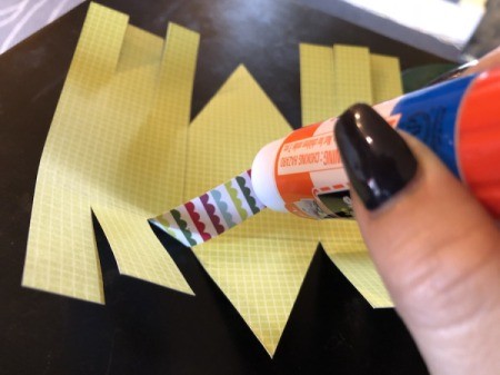Craft Paper Basket - apply glue to the top of the first strip next to the middle flap