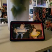 Old Phone Case as Photo Frame - case reassembled with baby photos