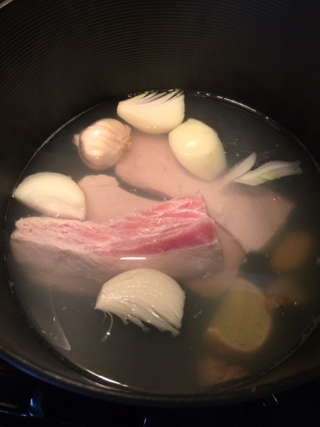 Pork and water added to pan