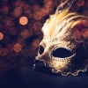 Masquerade mask on a black table.