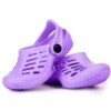 Purple Crocs shoes on white background