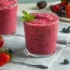 Berry Smoothie with blueberries and strawberries in the  background