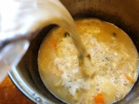 adding blended soup back to pot Soup