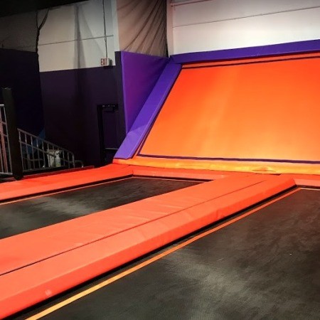 A trampoline playspace with no people.