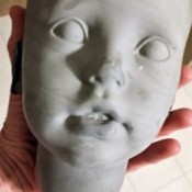 Identifying the Head Mold for a Rubert Doll - face of molded head