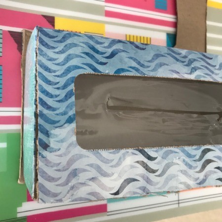 Coupon Organizer Made from a Tissue Box Made from a Tissue Box - tissue box on piece of cardboard