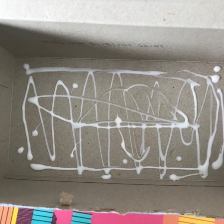 Coupon Organizer Made from a Tissue Box - apply glue to box base and glue down the design paper