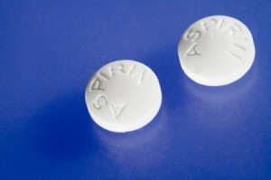 Close-up of aspirin pills on blue background